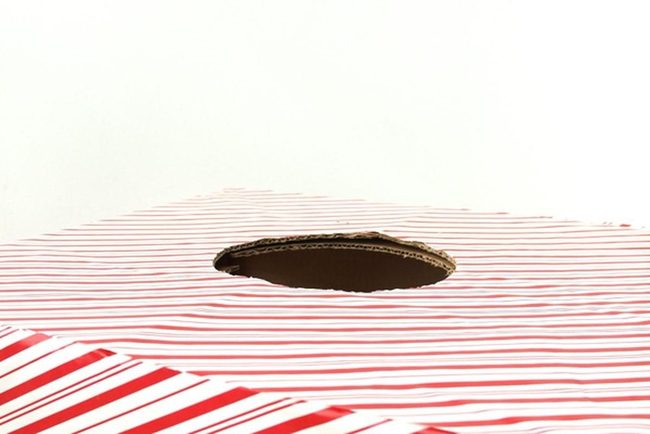 Red Stripes Reveal Cardboard Layers