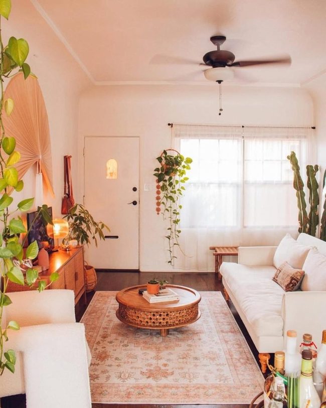 Lush Green Living Room With Wicker