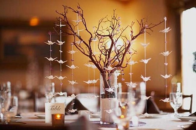 Hanging Ornaments Illuminate Tall Branches