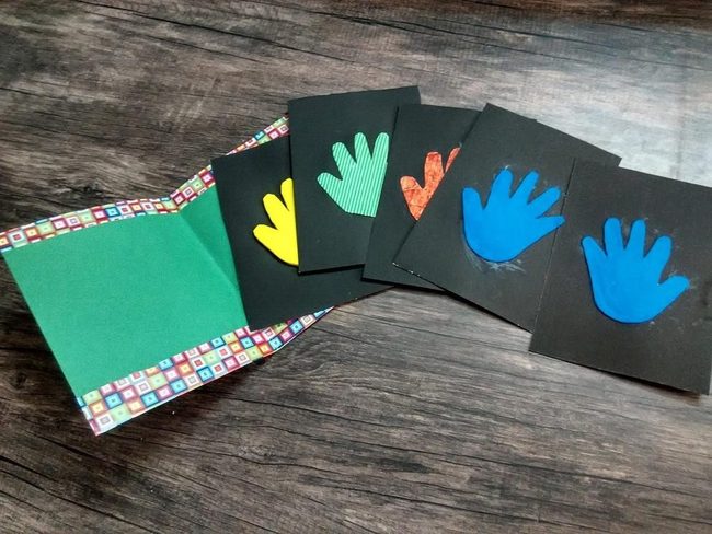 Colorful Handprints On Black