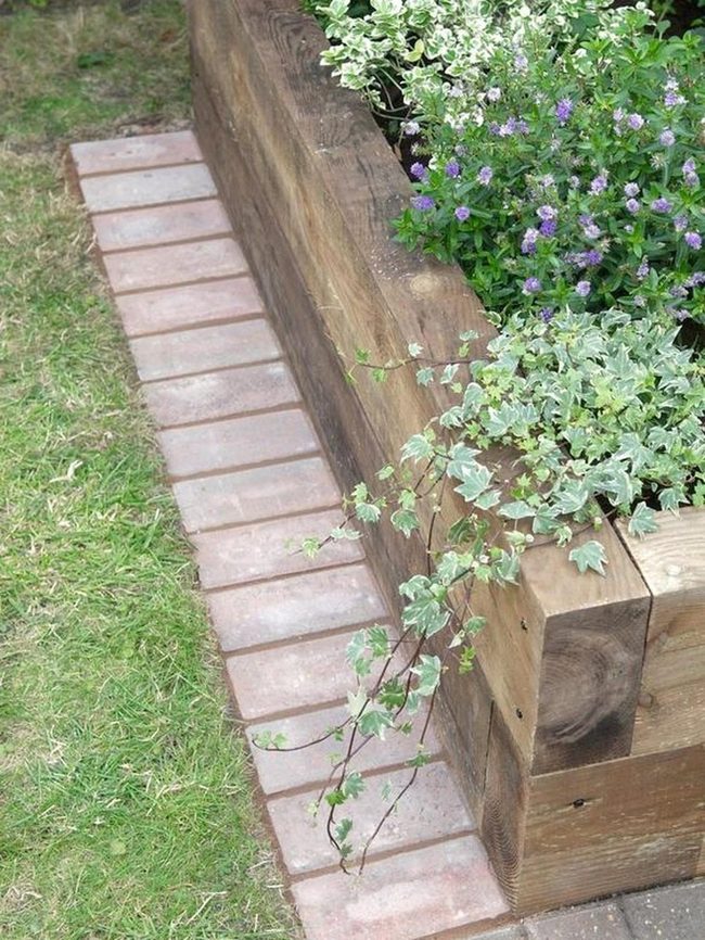 Purple Flowers In Wooden Planters