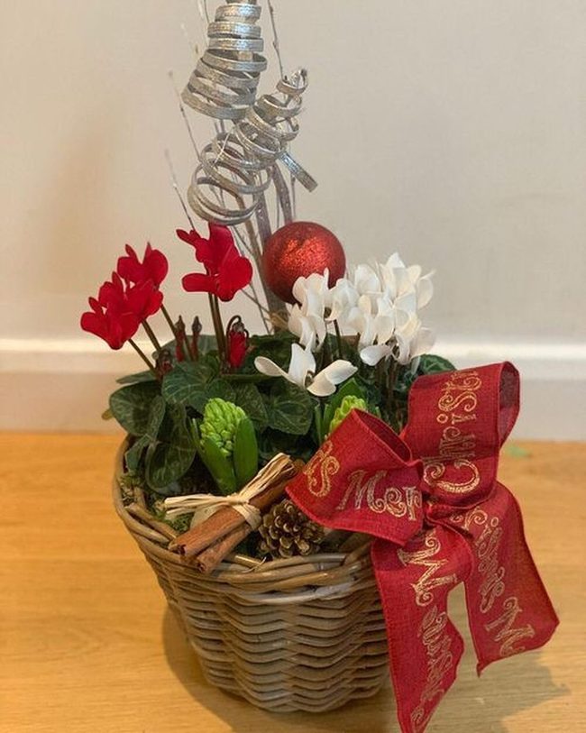 Woven Baskets With Evergreen And Berries