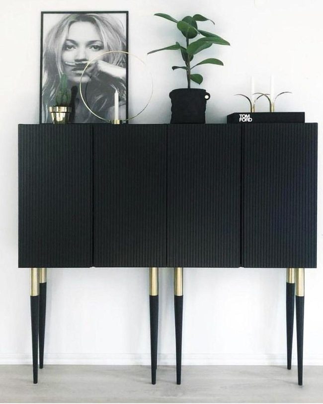Black Fluted Cabinet With Brass Leg Touches