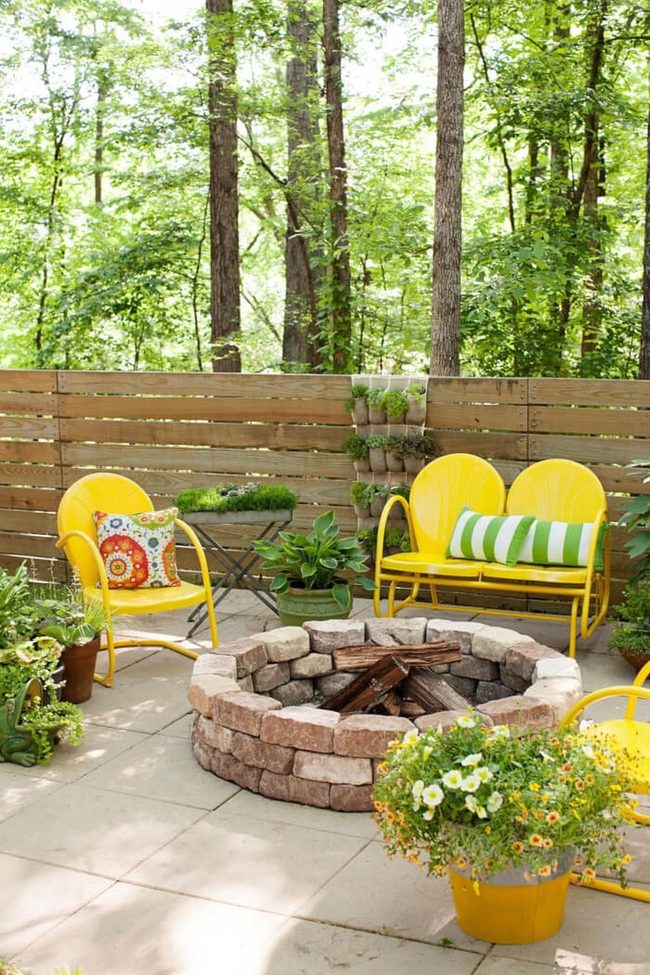 Yellow Chairs And Stone Fire Pit
