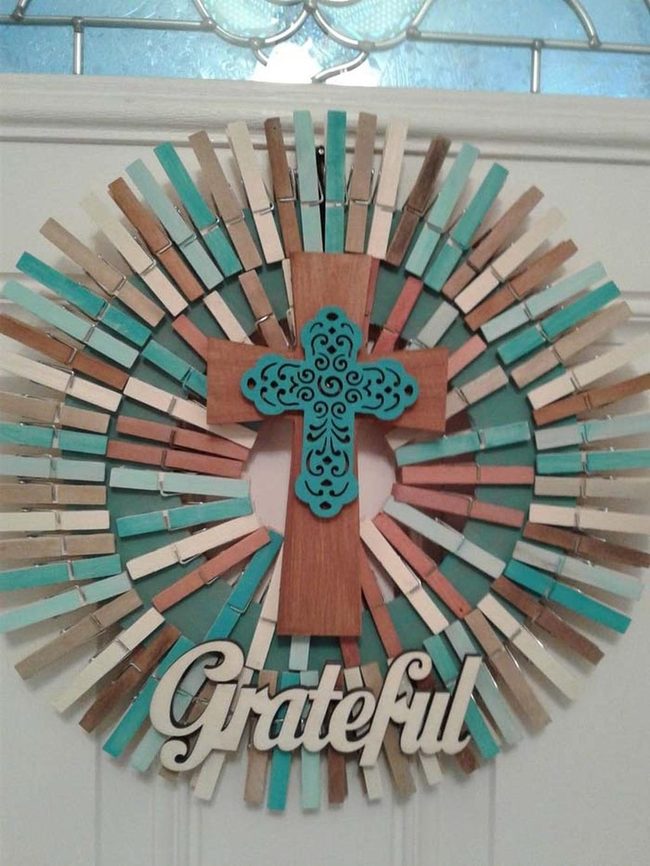 Pastel Clothespins On Teal Cross