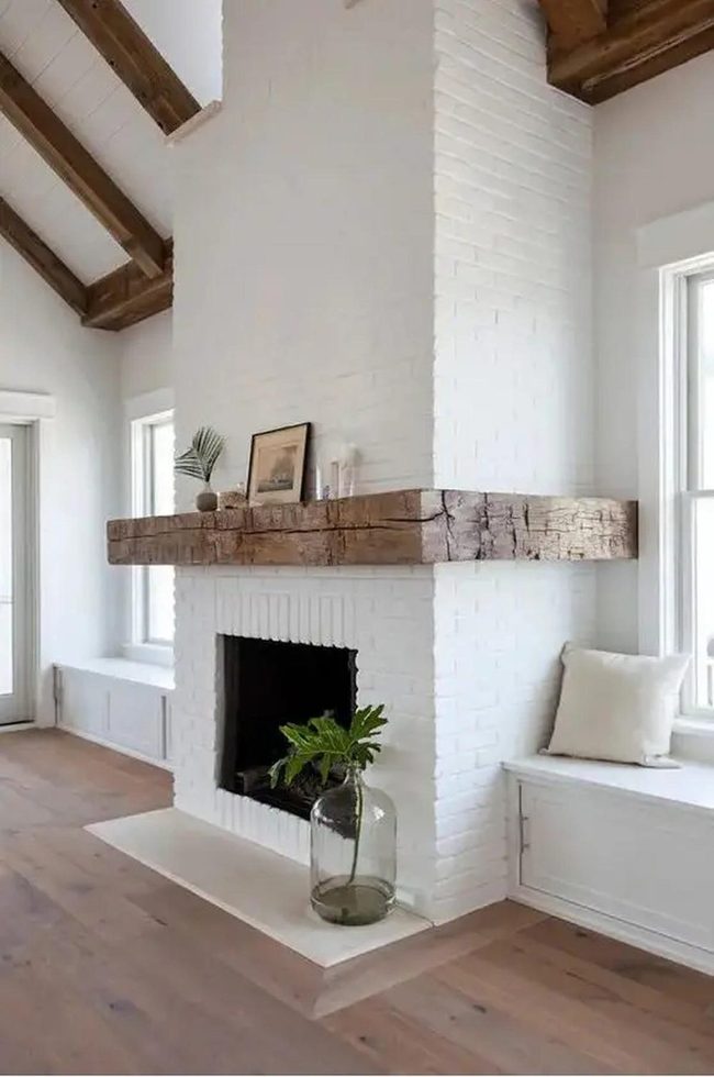 White Brick Fireplace With Timber Beams