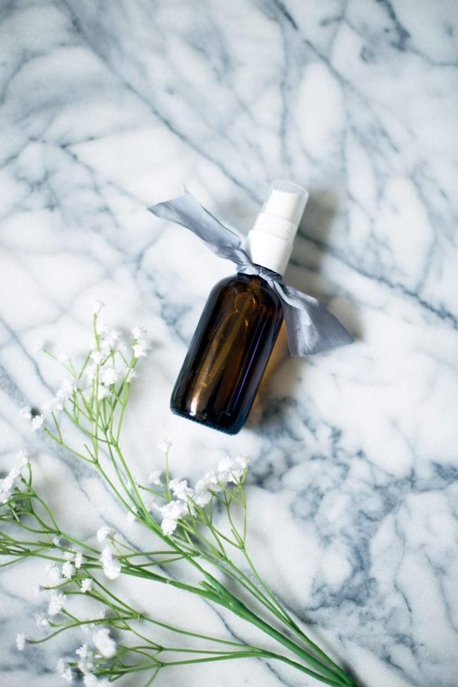 Dark Glass Perfume On Marble