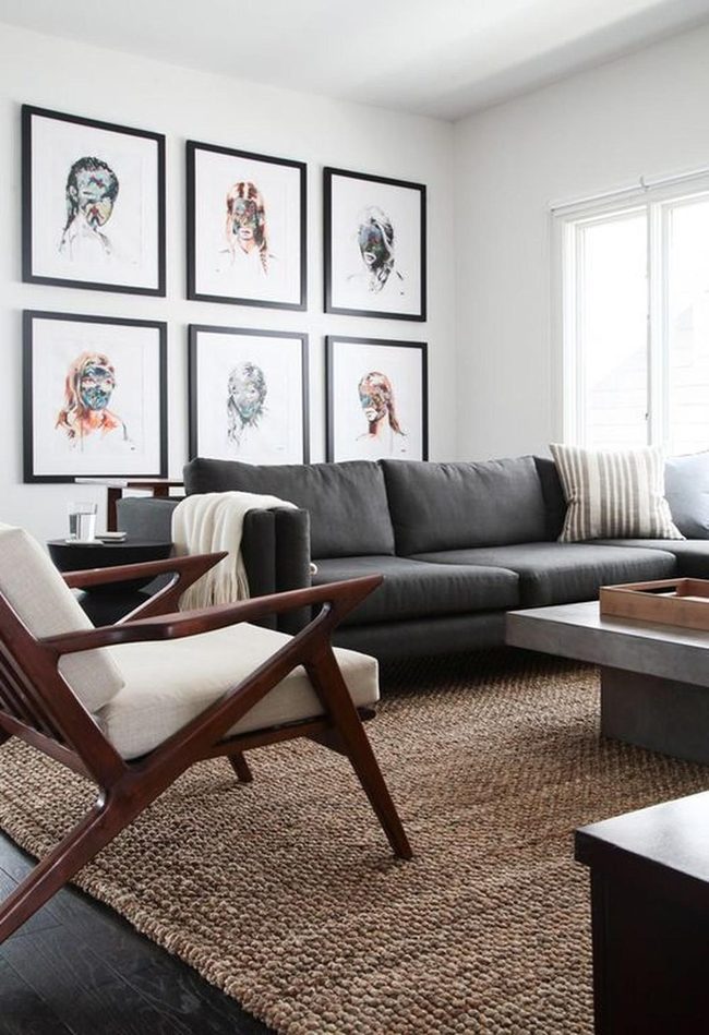 Abstract Faces Above Gray Sofa