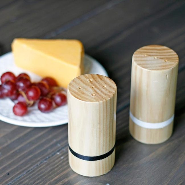 Striped Shakers On Wooden Table