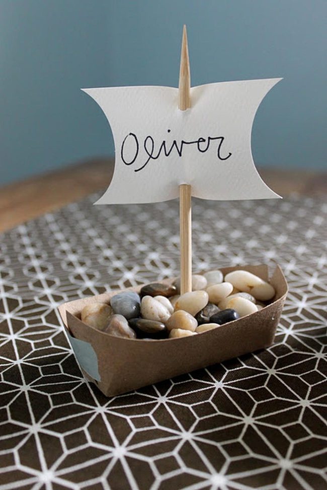 Brown Paper Boat With Stone