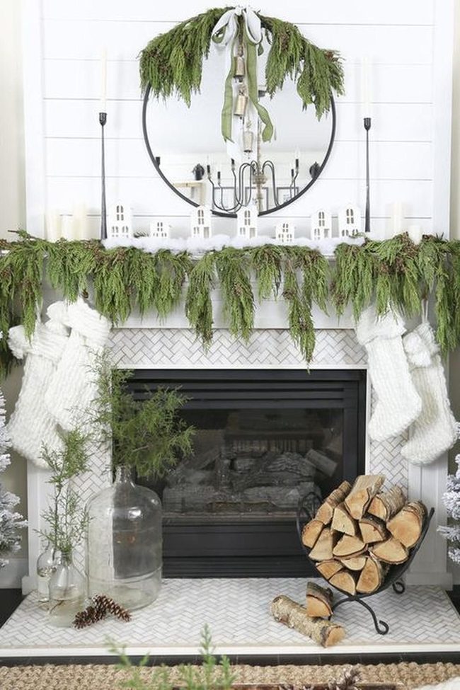 White Brick Fireplace With Green Garland