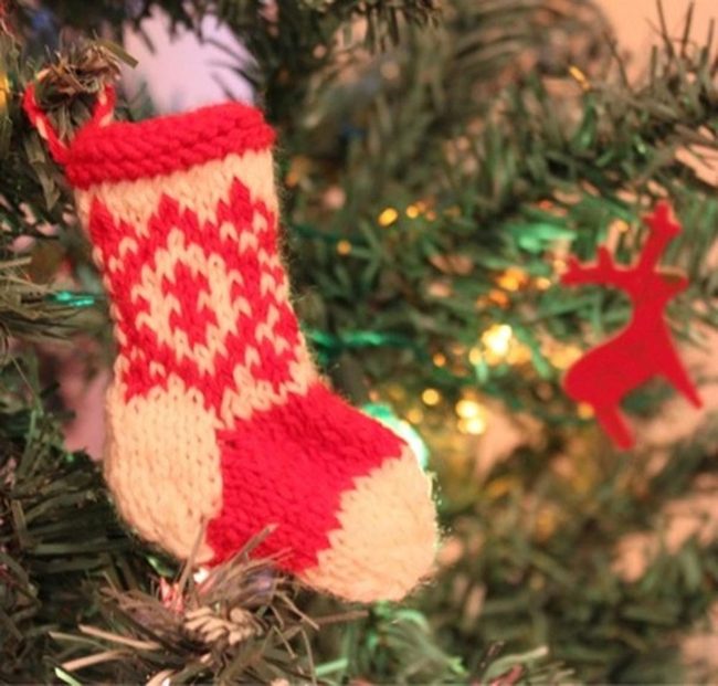 Red Knit Stockings On Green Branches
