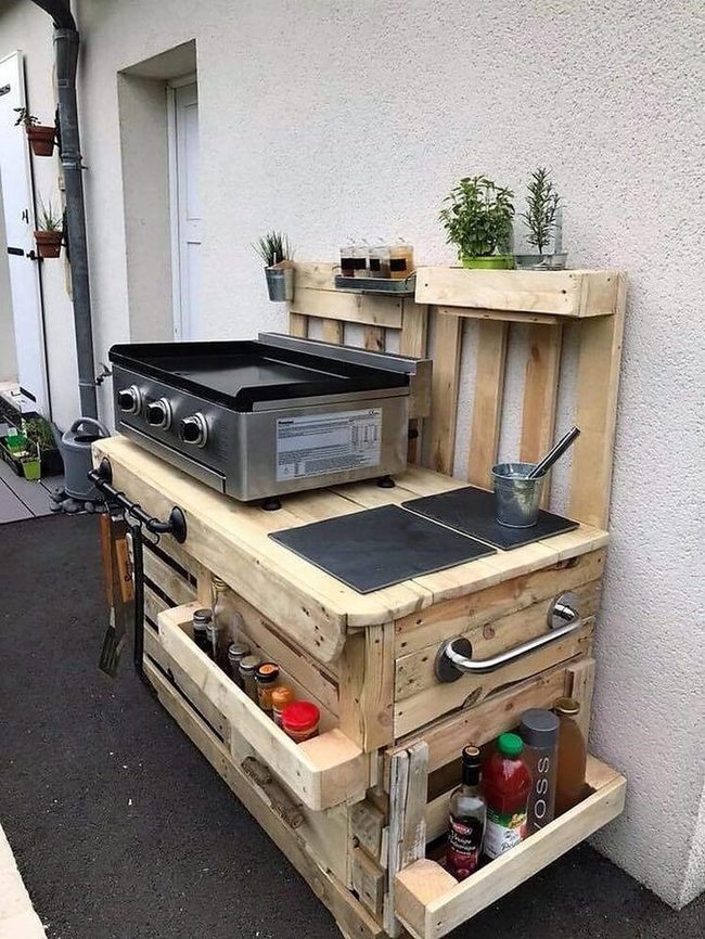 Gleaming Metal Grill, Wooden Pallets