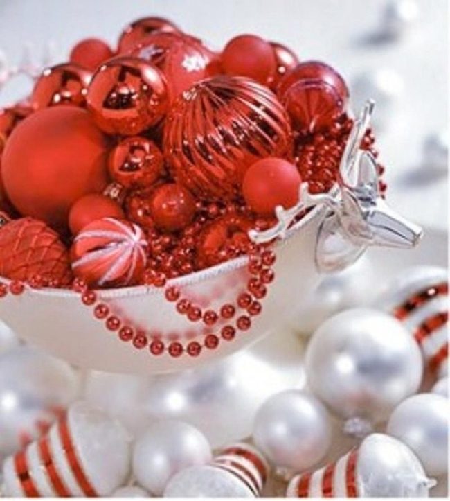 Red Ornaments In White Ceramic Bowl