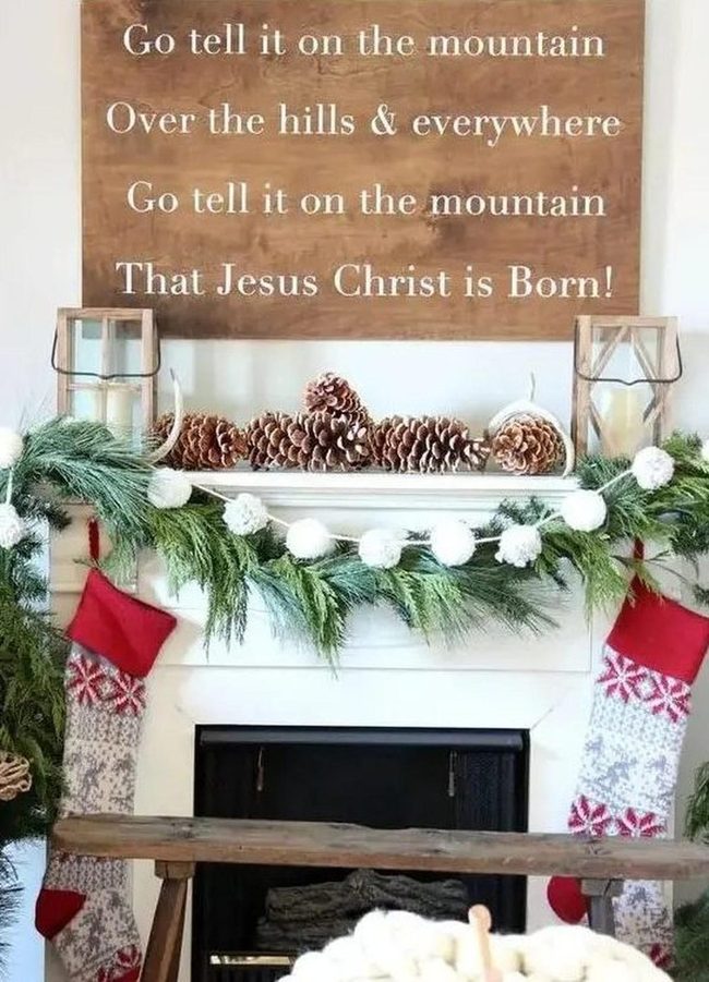 White Fireplace With Green Pine Garlands