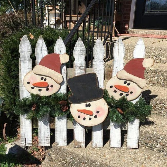 Snowmen Trio On Weathered Fence