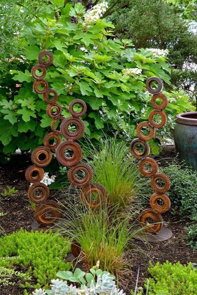 Metal Sculptures Among Dancing Grasses
