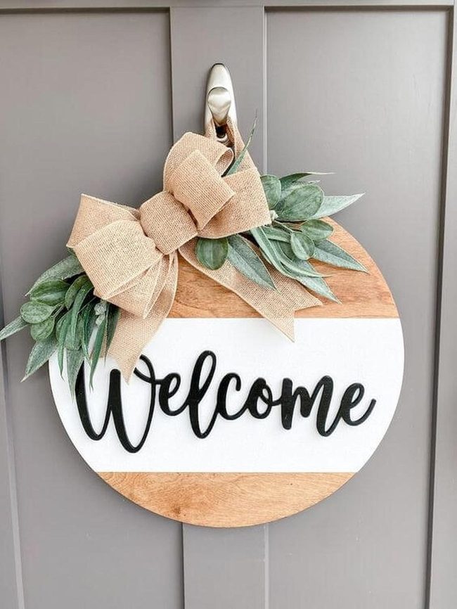 Wooden Welcome Sign With Greenery