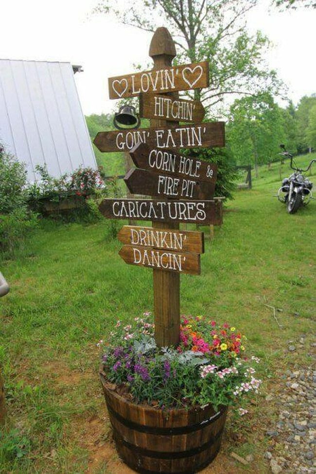 Wooden Arrow Signposts With Flowers