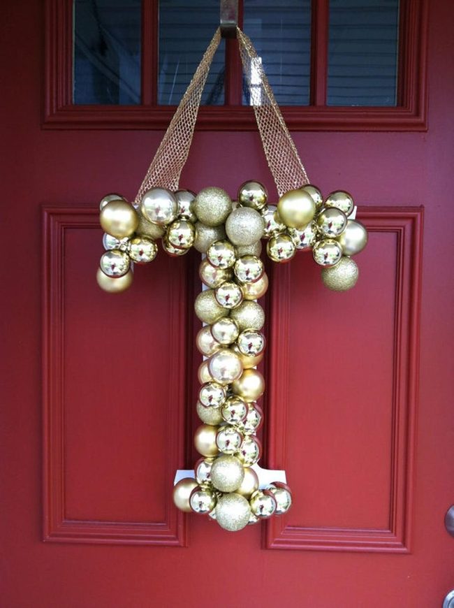 Gold Ornaments On Crimson Door