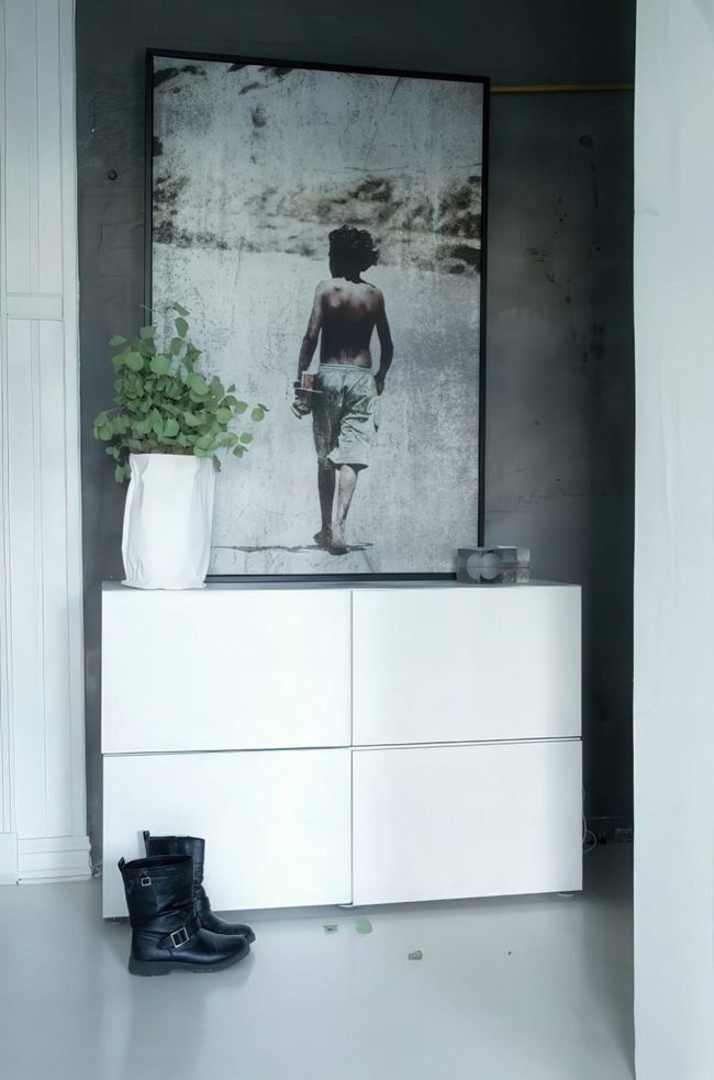 White Furniture Against Black Walls