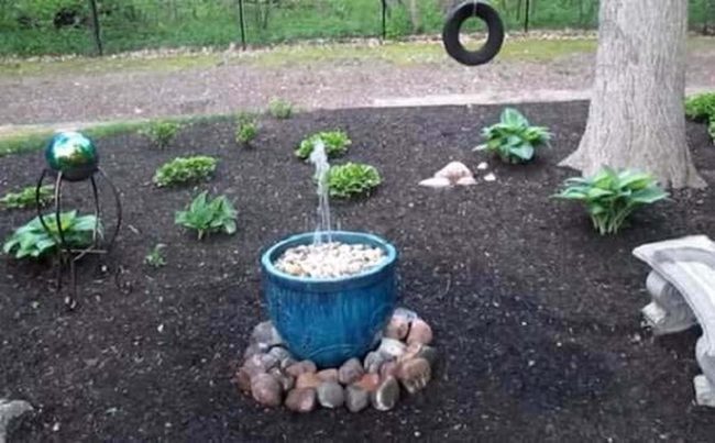 Glazed Pot Fountain With River Stones