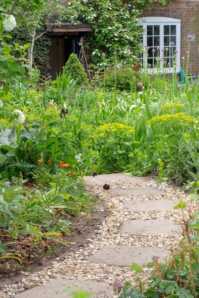 Stone Path Through Blooming Garden
