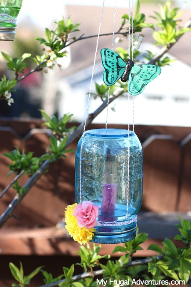Blue Glass Candles Pink Flowers Garden