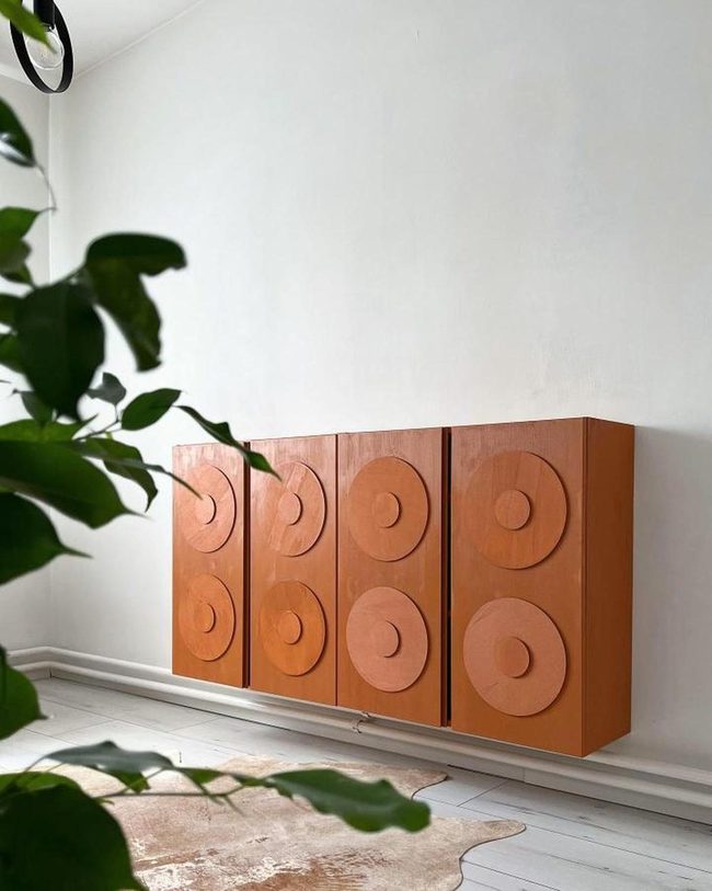 Orange Cabinet With Geometric Lumber Circles