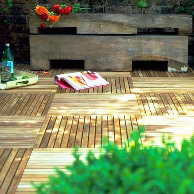 Orange Blooms On Wooden Deck