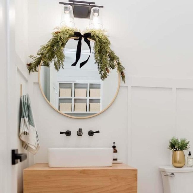 Circular Mirror Above White Vessel Sink