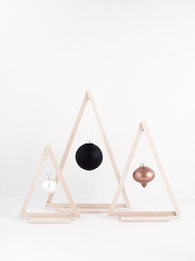Geometric Wood Frames With Metallic Orbs