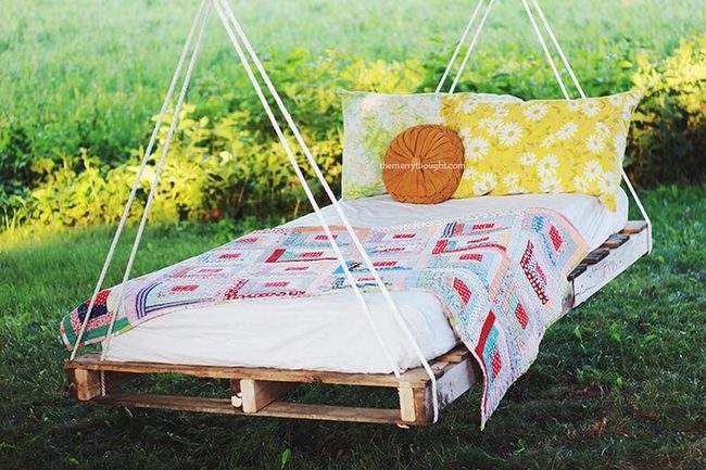 Elevated Pallet Bed Among Trees