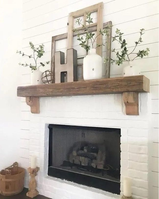 White Brick Fireplace With Green Branches