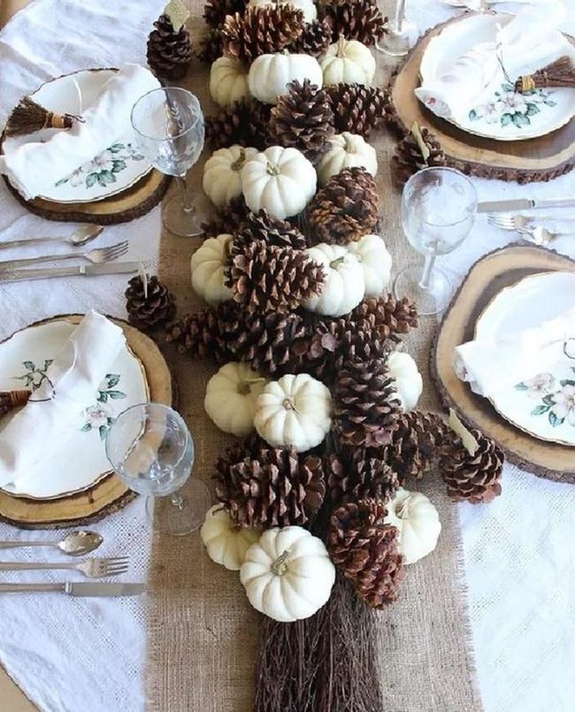 White Pumpkins, Pinecones, And Burlap