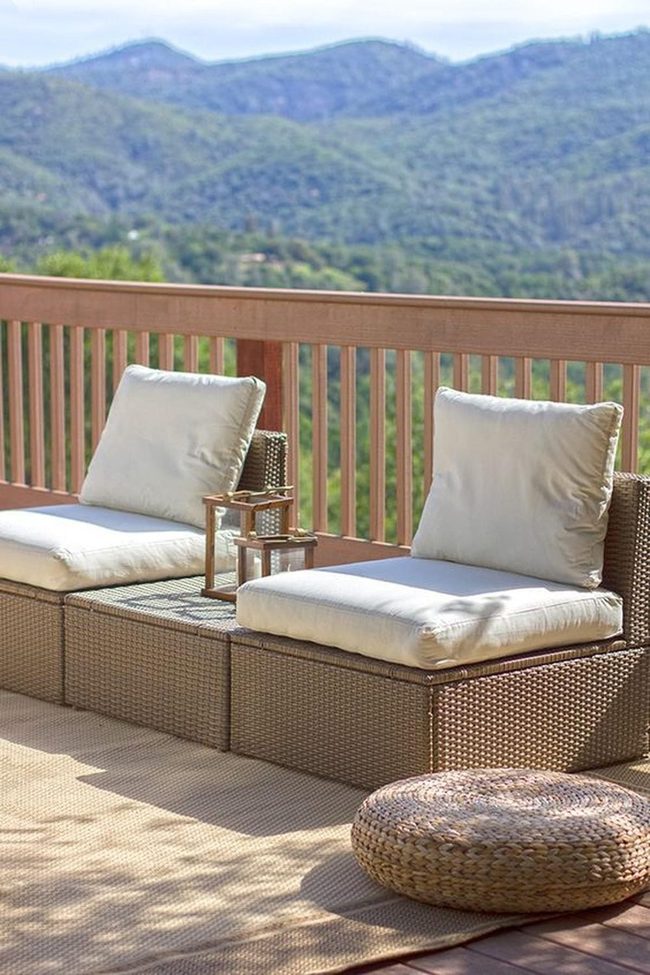 Wicker Chairs Facing Green Hills