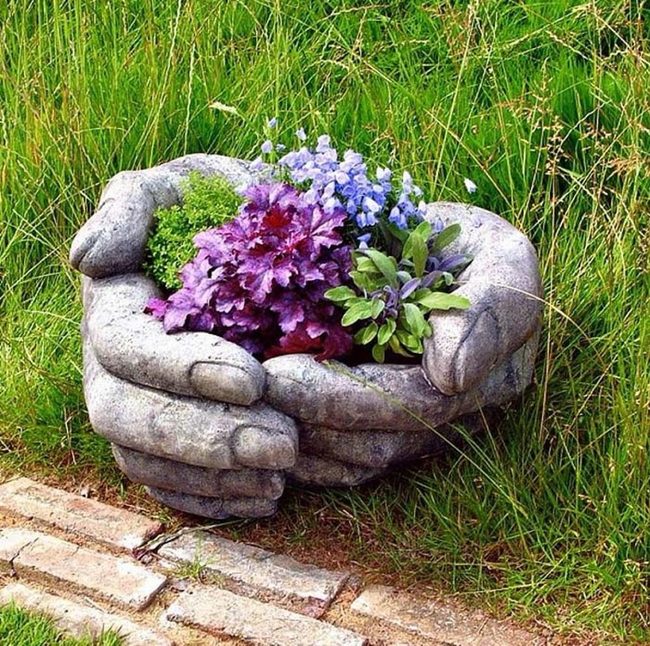 Stone Hands Cradling Blooms