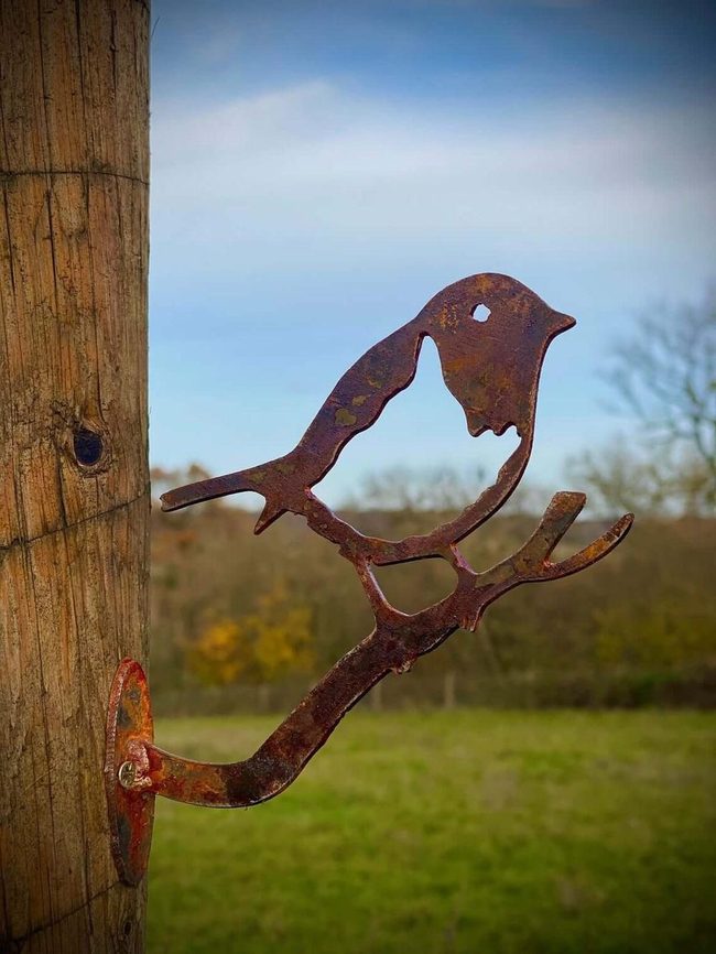 Weathered Metal Birds On Wire