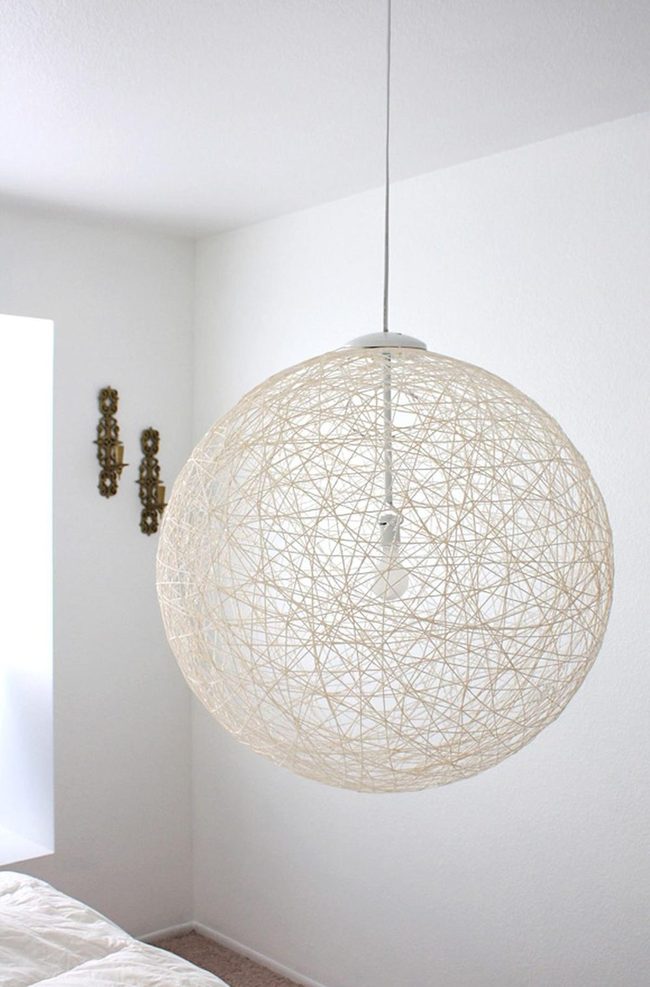 White Minimalist Bedroom With Woven Ceiling Fixture