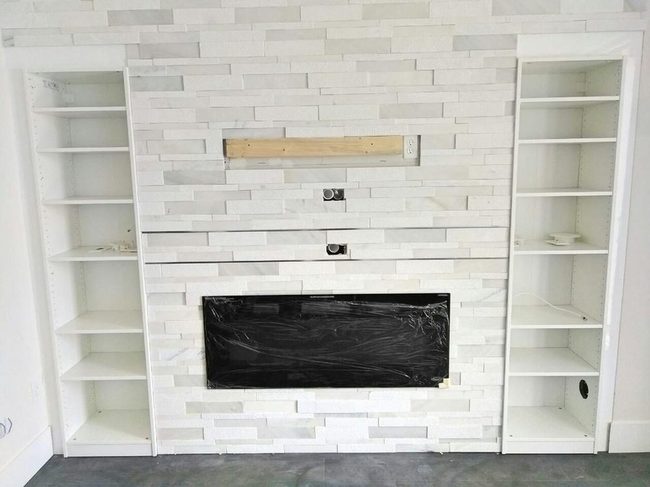 Black Fireplace, White Brick Statement
