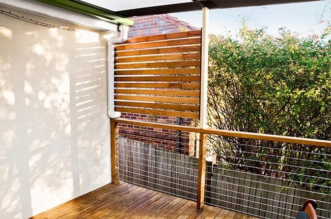 Green-Filtered Light Through Wooden Slats