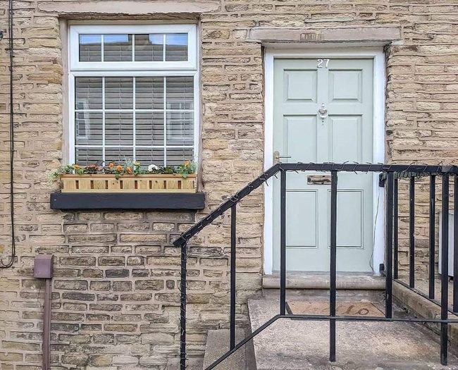 Black Railing Brick Entryway