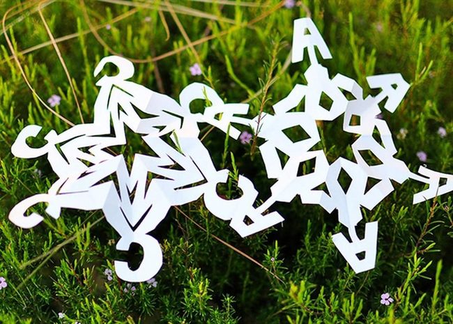 White Cutouts On Emerald Grass