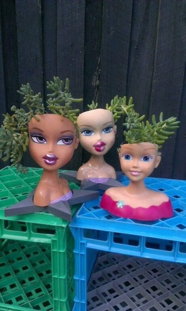 Ceramic Heads Sprouting Flowers