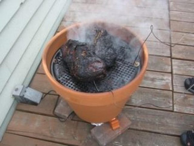 Clay Smoker On Wooden Deck