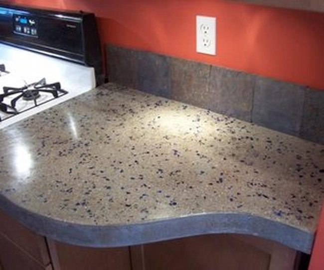 Red-Orange Kitchen With Speckled Stone