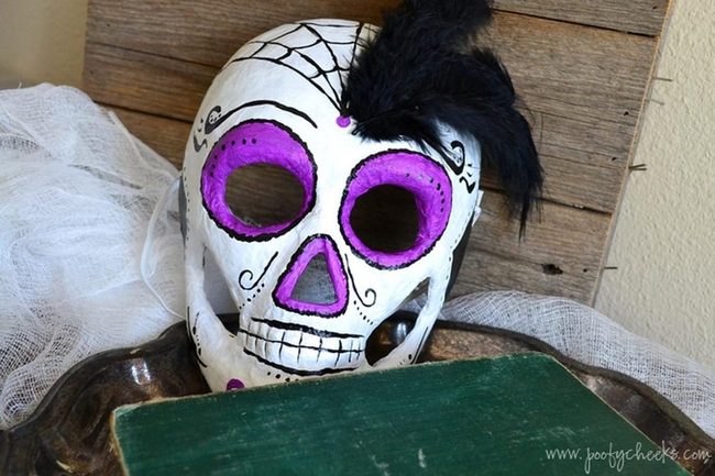 Purple-Eyed Skull Masks With Feathers