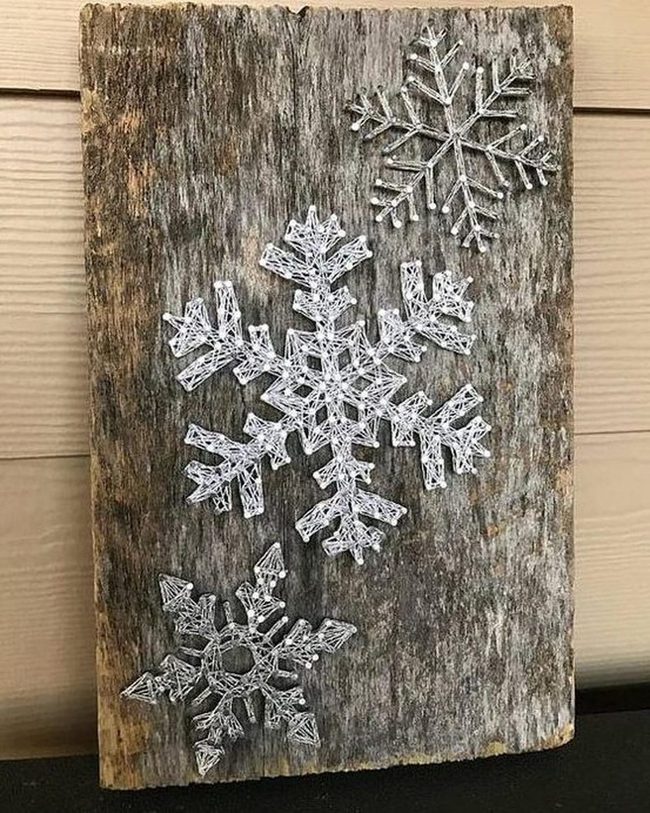 White String Snowflakes On Wood