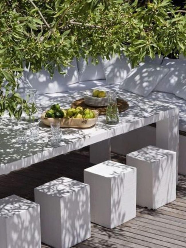 White Furniture Under Dappled Shade