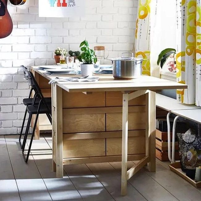 White Brick Kitchen With Black Chairs